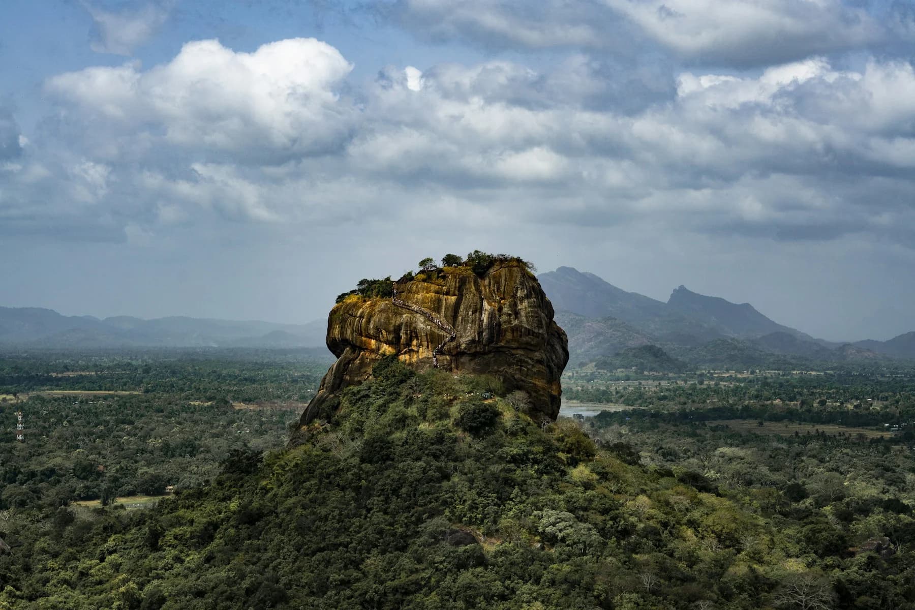 Sigiriya rock fortress rising above the green Sri Lankan landscape